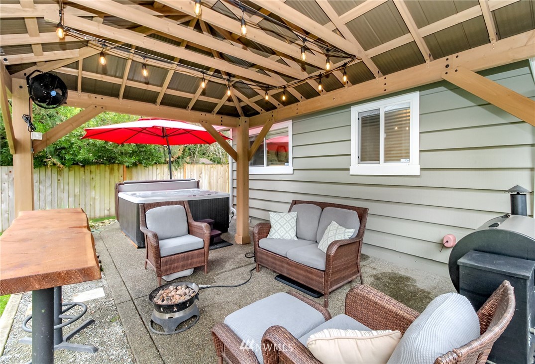 17021 Southeast Jones Road Renton, WA 98058 - Photo 18 of 27 a building outdoor space with patio furniture