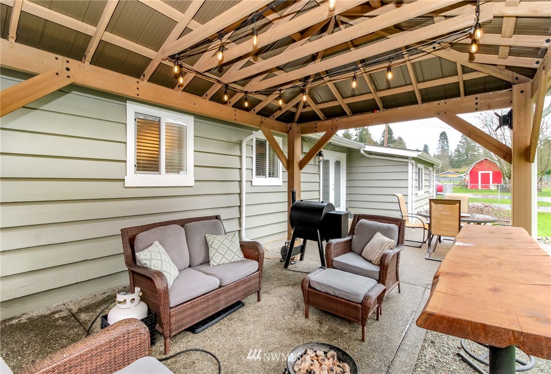 17021 Southeast Jones Road Renton, WA 98058 - Photo 19 of 27 a building outdoor space with patio furniture