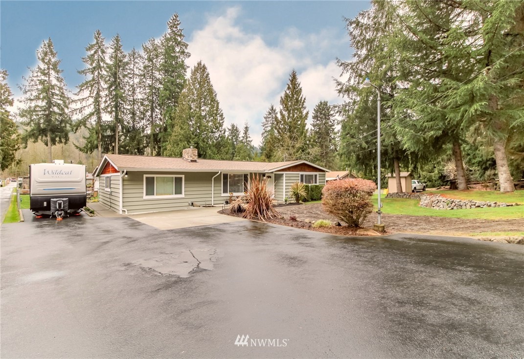 17021 Southeast Jones Road Renton, WA 98058 - Photo 2 of 27 a view of a house with backyard and sitting area