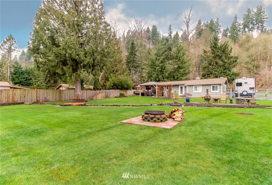 17021 Southeast Jones Road Renton, WA 98058 - Photo 26 of 27 a front view of a house with garden