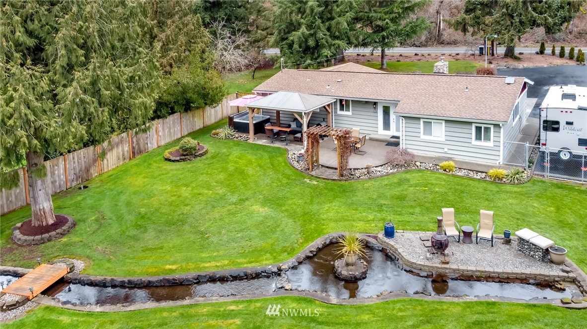 17021 Southeast Jones Road Renton, WA 98058 - Photo 27 of 27 a aerial view of a house with swimming pool and a yard