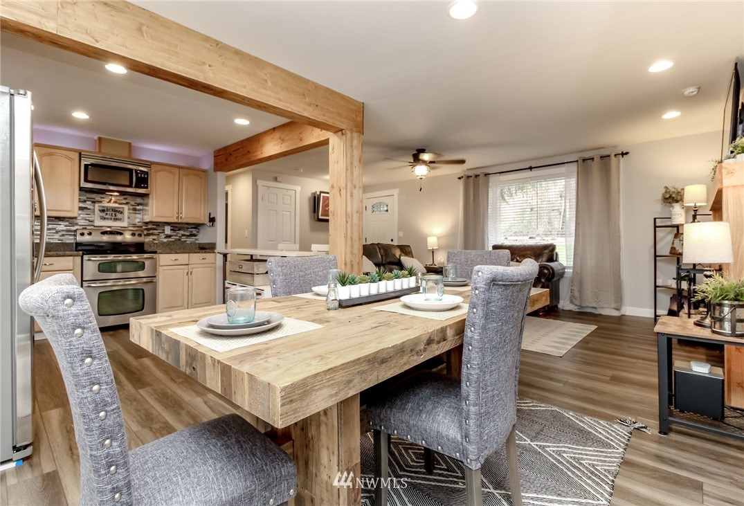 17021 Southeast Jones Road Renton, WA 98058 - Photo 7 of 27 a large kitchen with a table and chairs