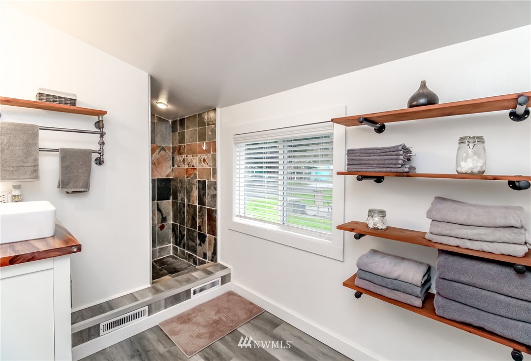 17021 Southeast Jones Road Renton, WA 98058 - Photo 10 of 27 a bedroom with furniture and a window