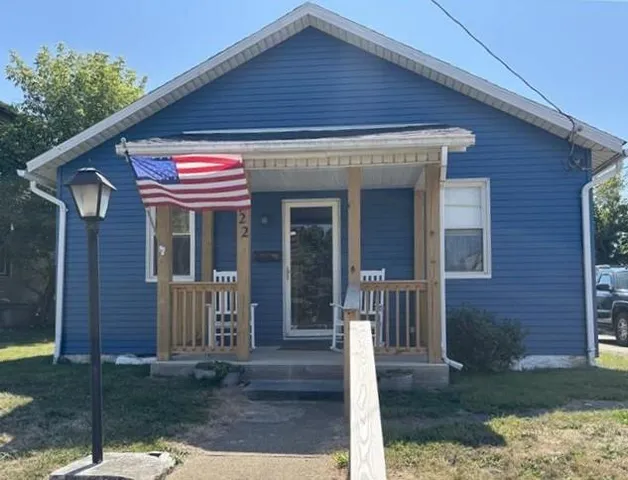 a front view of a house with a porch