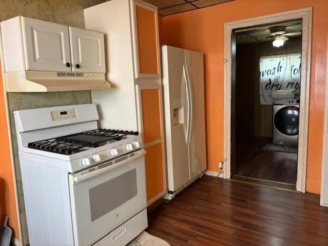 a kitchen with stainless steel appliances granite countertop a stove and a refrigerator