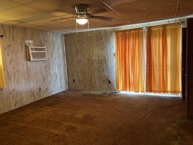 a view of empty room with windows