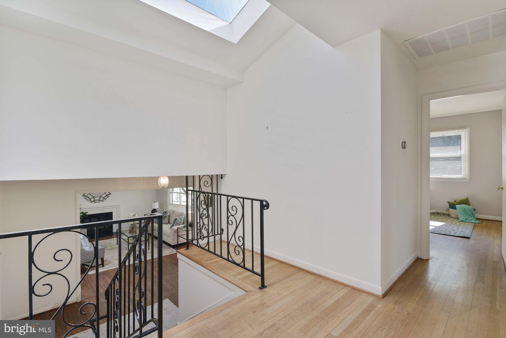 7721 Brookville Road Chevy Chase, MD 20815 - Photo 11 of 30 Bedroom level hall has nice skylight