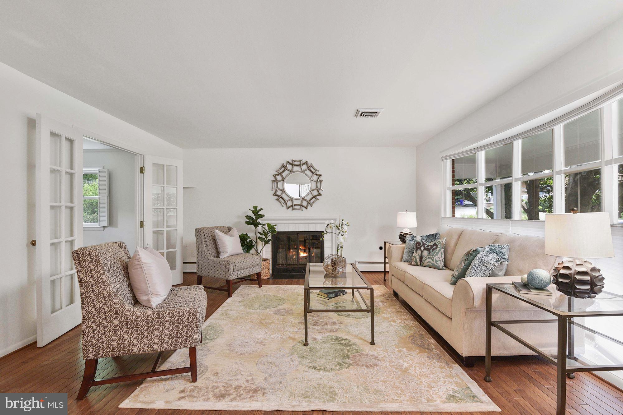 7721 Brookville Road Chevy Chase, MD 20815 - Photo 4 of 30 Living room has fireplace and bay window