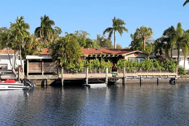 a view of swimming pool with outdoor seating and deck