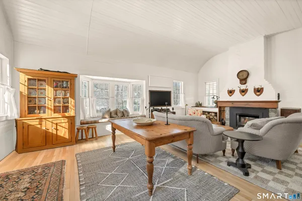 a workspace with furniture and a fireplace