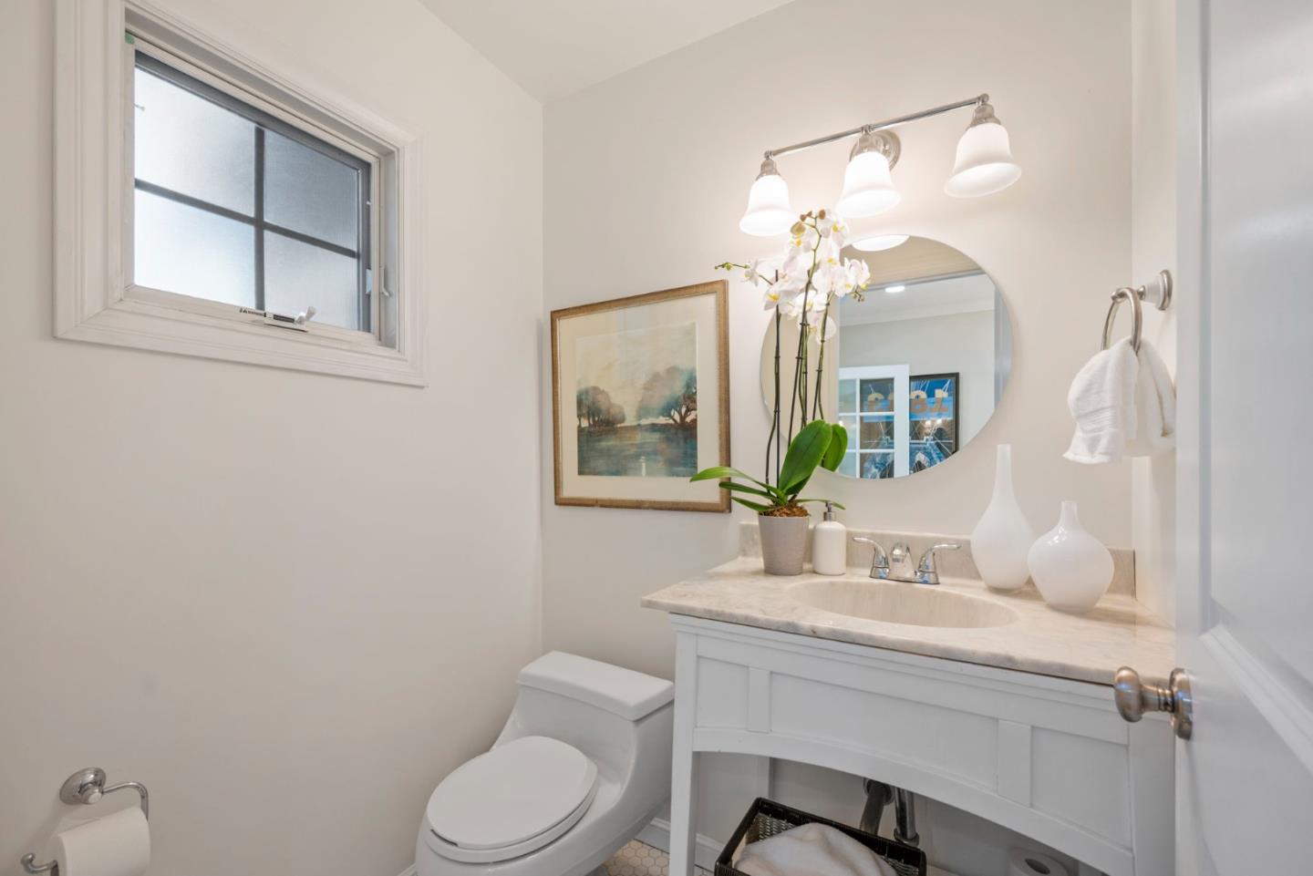 445 Arlington Road Redwood City, CA 94062 - Photo 35 of 50 a bathroom with a toilet a sink and mirror