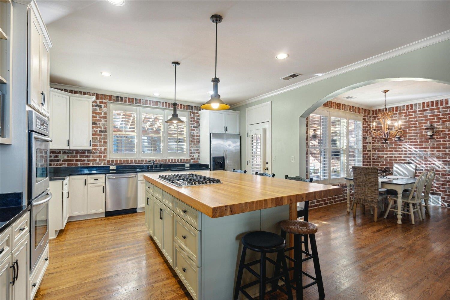 307 Colbert Street West Collierville, TN 38017 - Photo 11 of 34 Kitchen with plenty of natural light, a kitchen island, stainless steel appliances, and wood counters