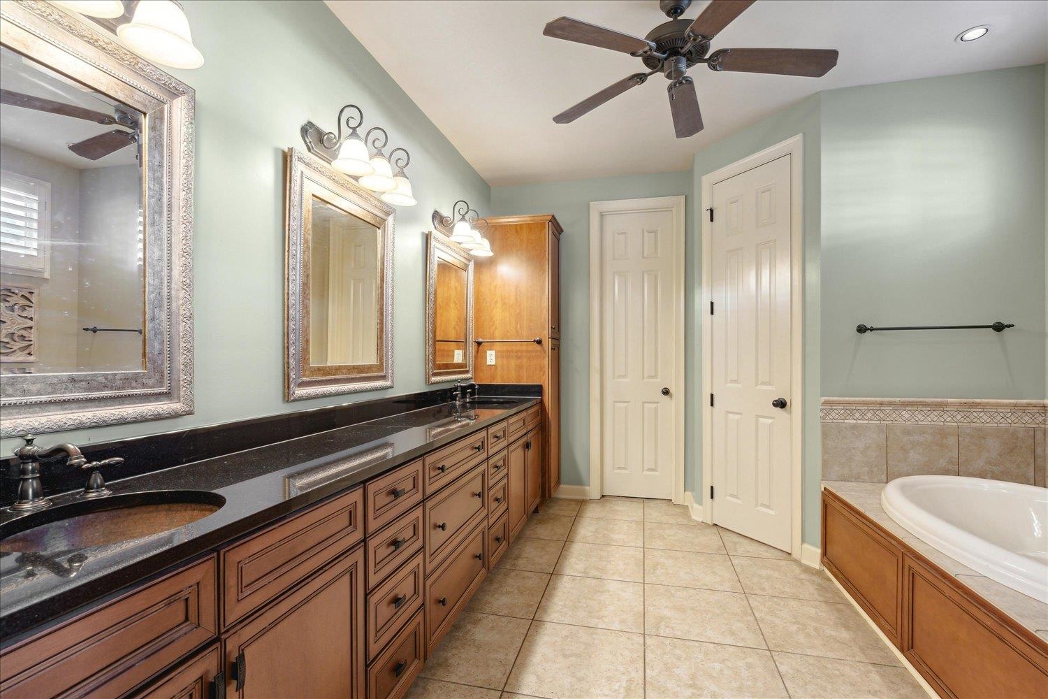 307 Colbert Street West Collierville, TN 38017 - Photo 20 of 34 Bathroom featuring vanity, ceiling fan, a bathtub, and tile patterned floors