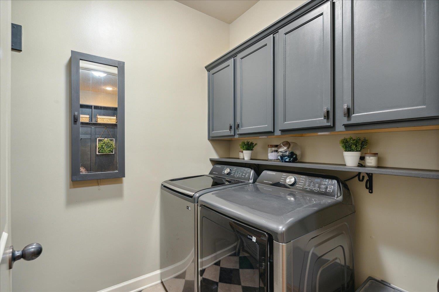 307 Colbert Street West Collierville, TN 38017 - Photo 23 of 34 Washroom featuring cabinets and washer and dryer