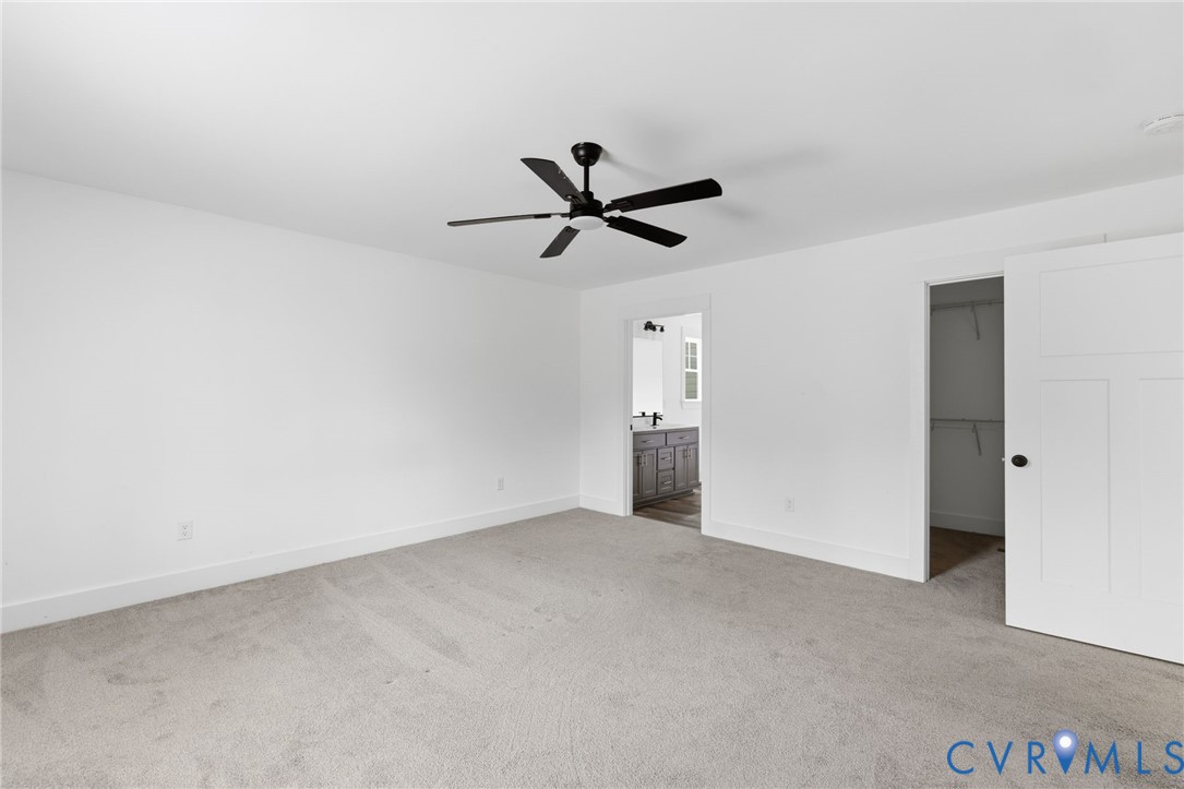 5245 Courtland Road Disputanta, VA 23842 - Photo 14 of 27 a view of a livingroom with a ceiling fan