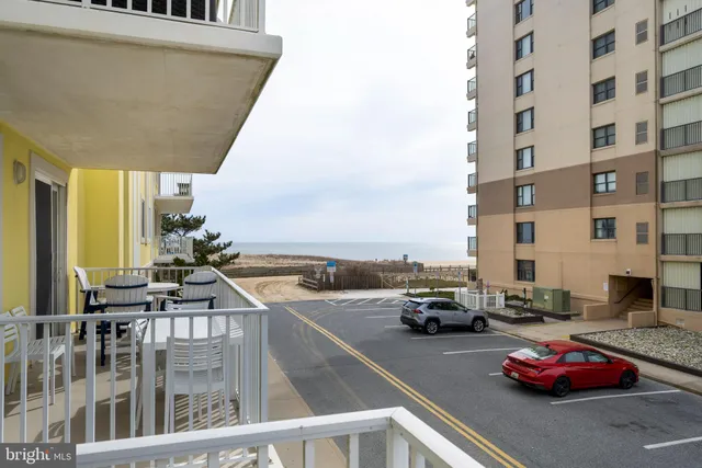 a view of a balcony with a table and chairs
