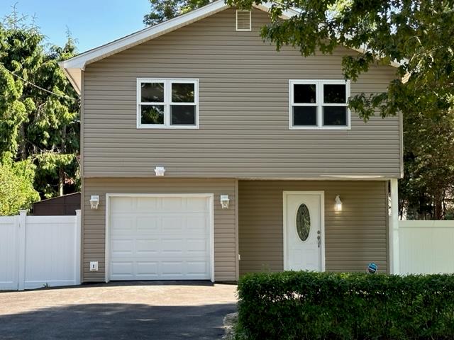 96 Patchogue Avenue Mastic, NY 11950 - Photo 1 of 1 a view of a house of a garage