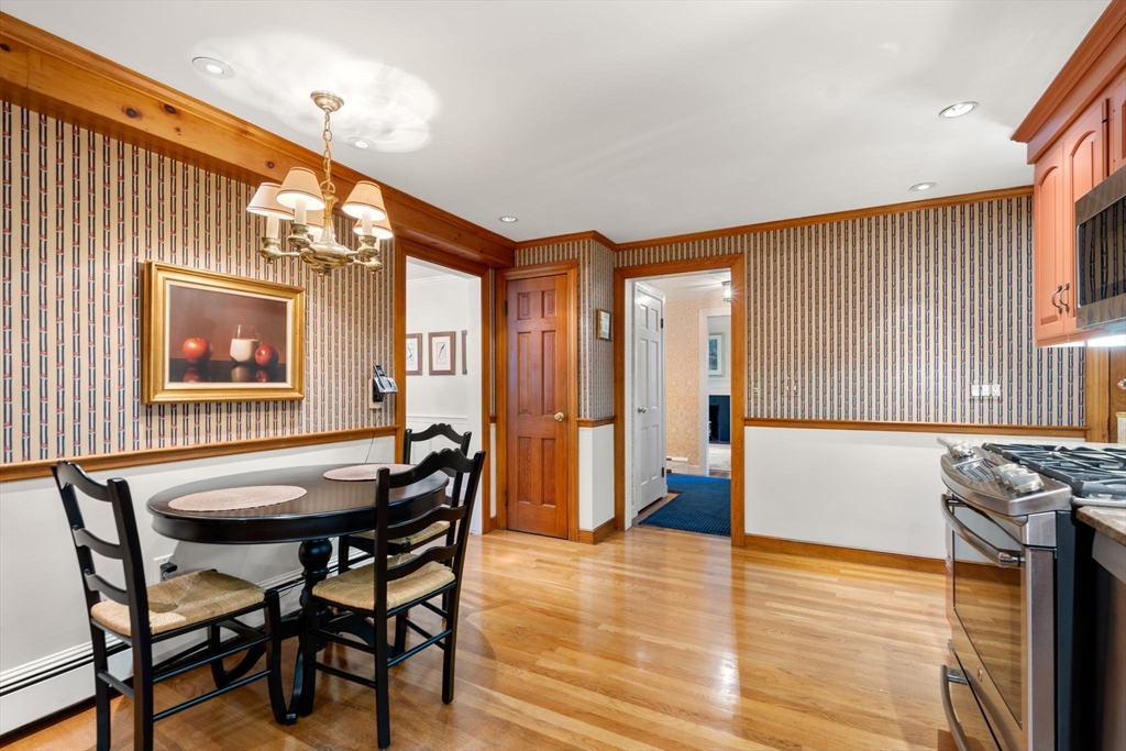 96 Elmwood Road Wellesley, MA 02481 - Photo 12 of 40 a view of a dining room with furniture and wooden floor