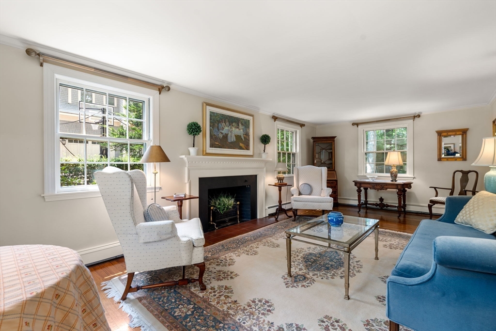 96 Elmwood Road Wellesley, MA 02481 - Photo 5 of 40 a living room with furniture a rug a fireplace and windows