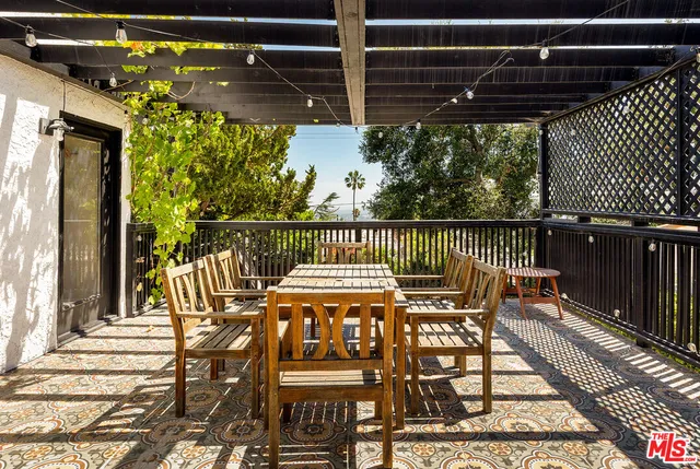 a view of a chairs and table on the deck