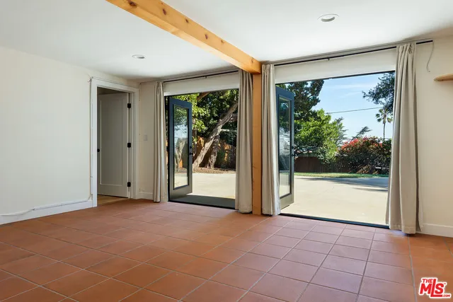 a view of a room with sliding glass door and mountain view