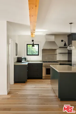 a kitchen with a stove and a refrigerator