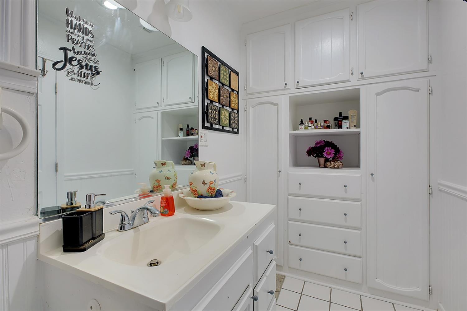1408 Hazel Street Gridley, CA 95948 - Photo 27 of 60 a bathroom with a sink and a mirror
