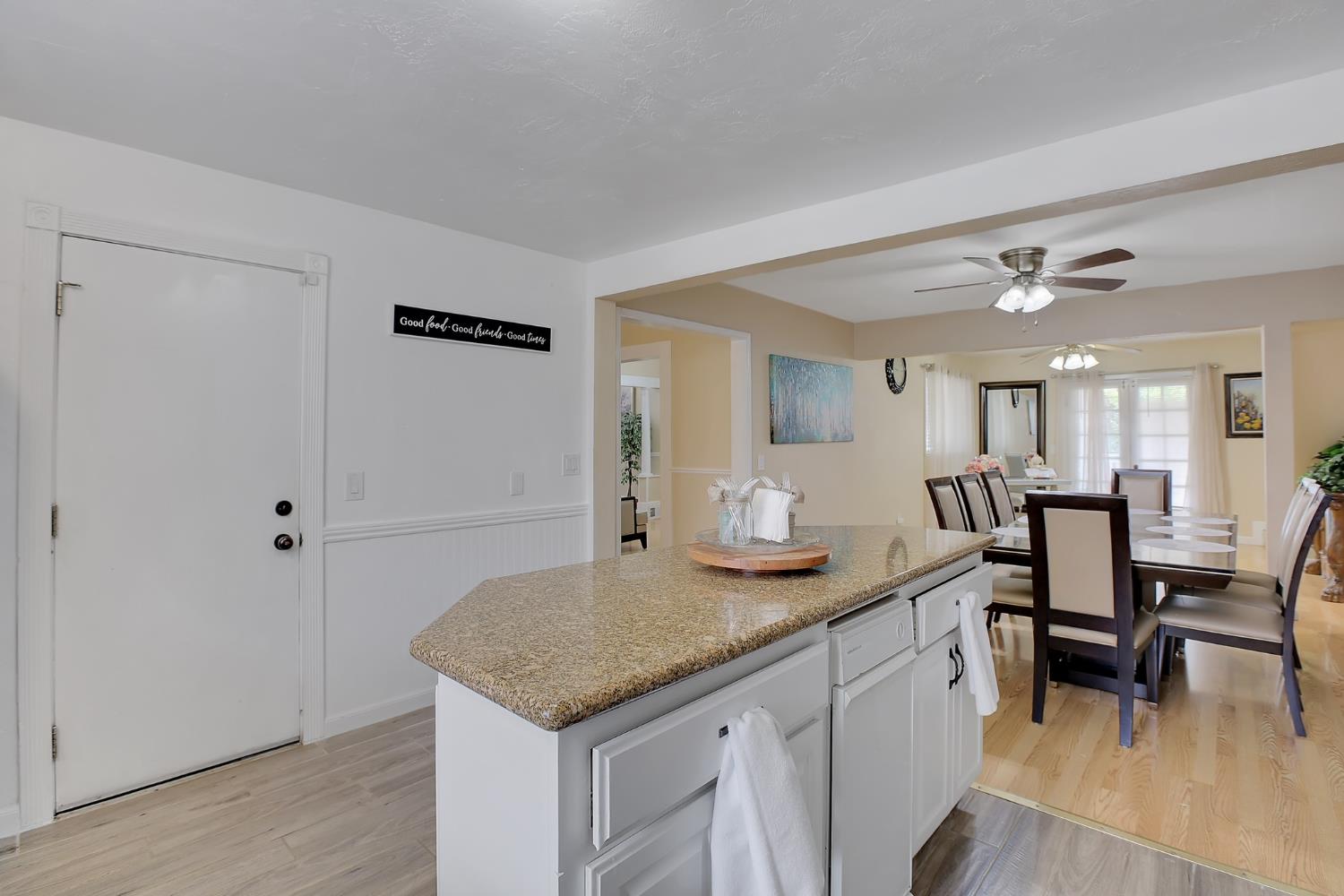 1408 Hazel Street Gridley, CA 95948 - Photo 42 of 60 a kitchen with a sink cabinets and wooden floor
