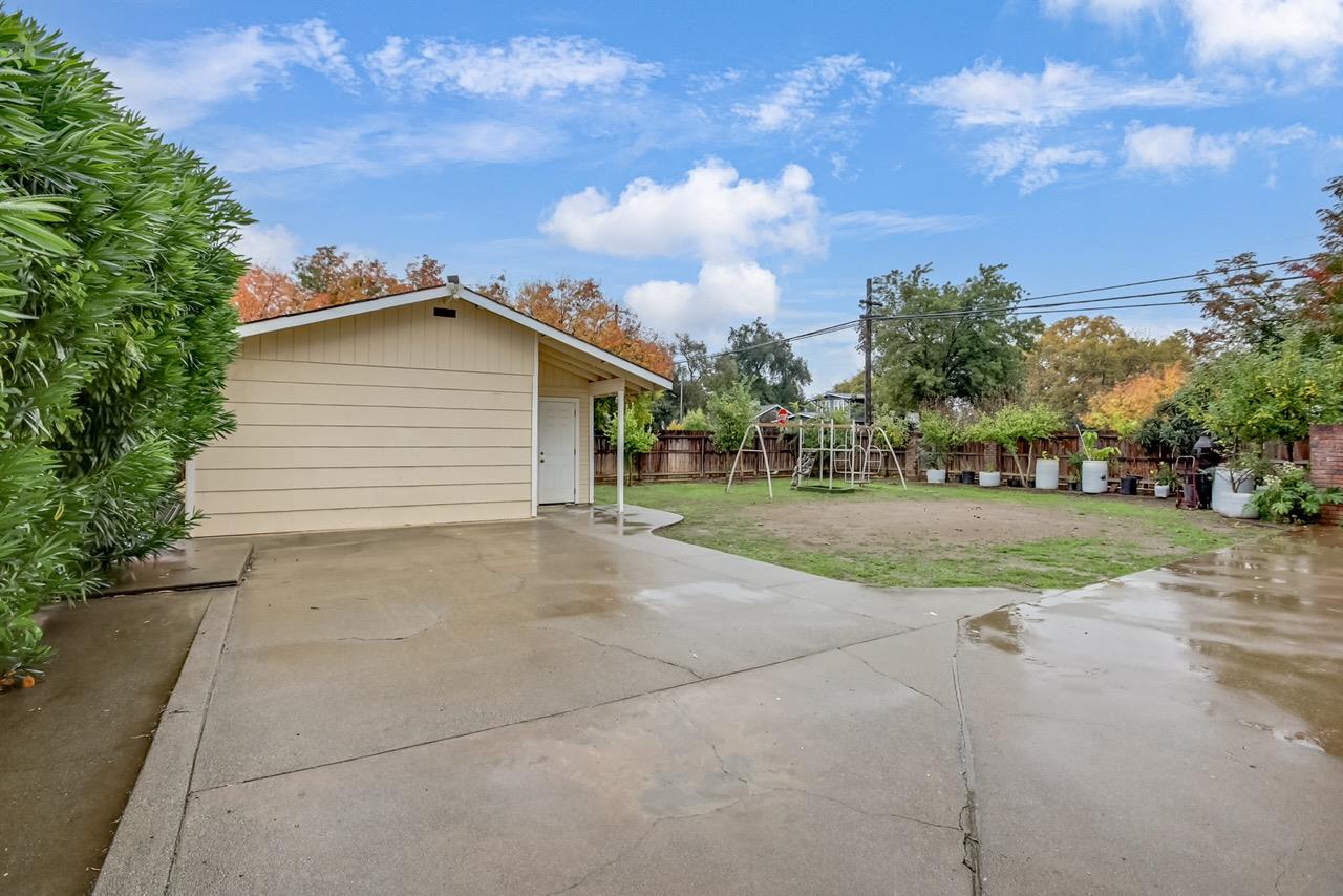 1408 Hazel Street Gridley, CA 95948 - Photo 56 of 60 a view of a house with a big yard and large trees