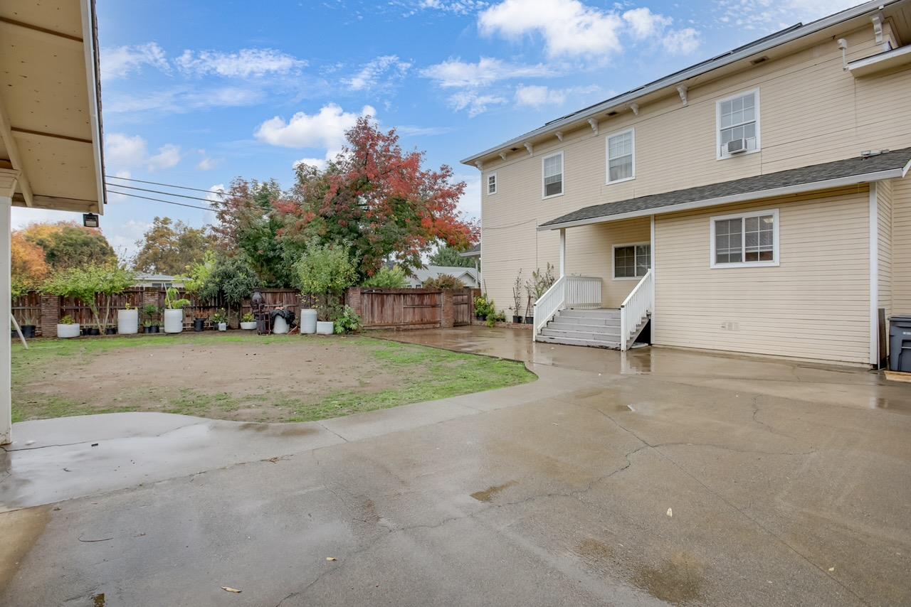1408 Hazel Street Gridley, CA 95948 - Photo 57 of 60 a view of a white house with a yard