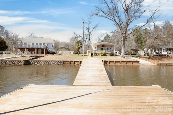 a view of a lake with boats and trees