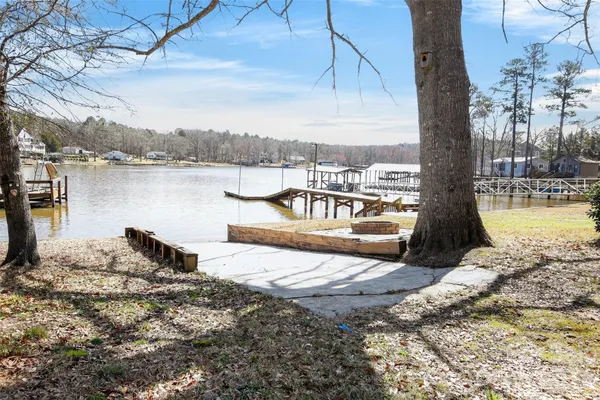 a view of a lake with houses in the background