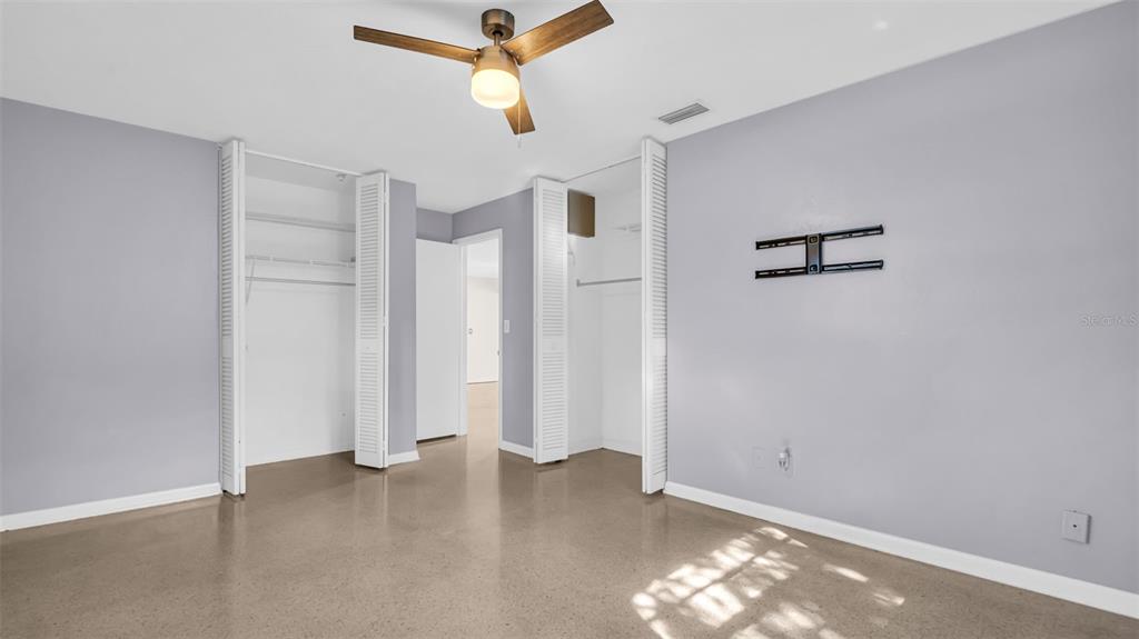 5831 Hillside Street Seminole, FL 33772 - Photo 12 of 26 an empty room with closet and windows