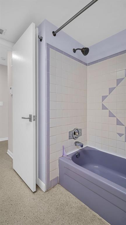 5831 Hillside Street Seminole, FL 33772 - Photo 24 of 26 a bathroom with a bathtub and a shower