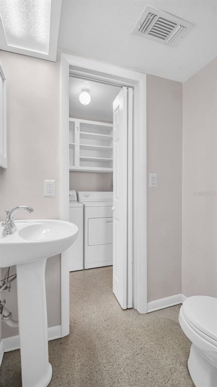 5831 Hillside Street Seminole, FL 33772 - Photo 26 of 26 a bathroom with a sink toilet and vanity