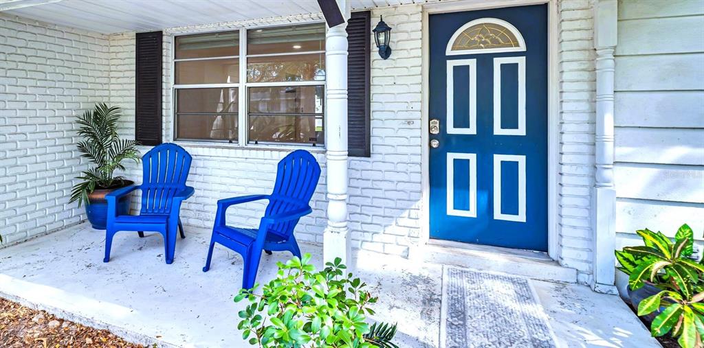 5831 Hillside Street Seminole, FL 33772 - Photo 3 of 26 a view of a house with a porch and furniture