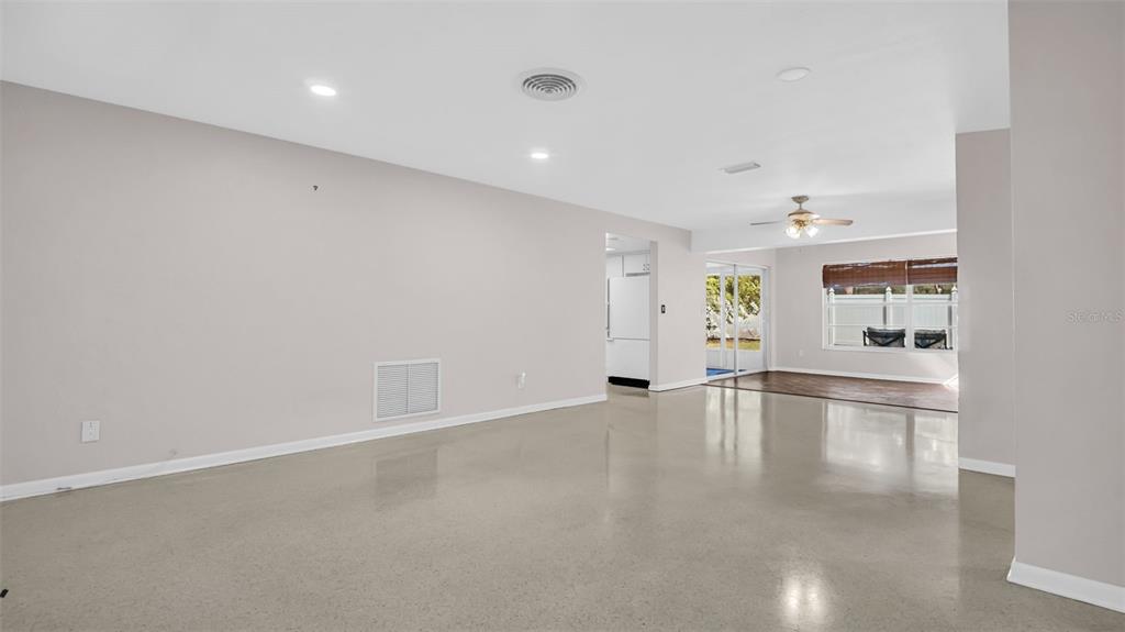 5831 Hillside Street Seminole, FL 33772 - Photo 7 of 26 an empty room with kitchen and window