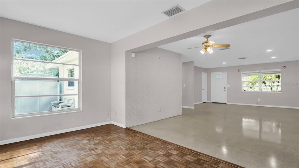 5831 Hillside Street Seminole, FL 33772 - Photo 8 of 26 an empty room with windows