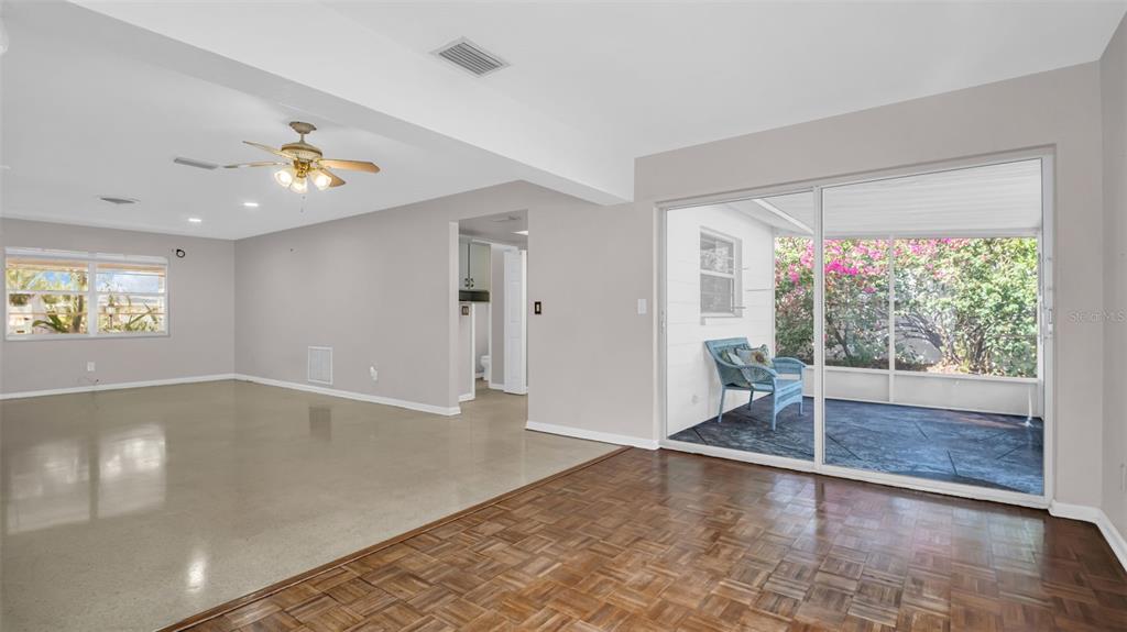 5831 Hillside Street Seminole, FL 33772 - Photo 9 of 26 wooden floor in an empty room with a window