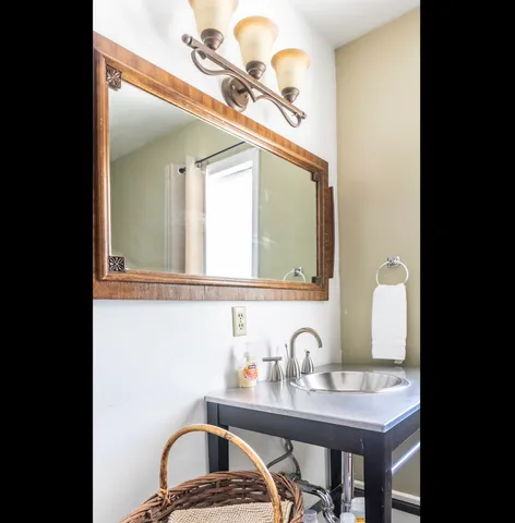 a bathroom with a sink and a mirror