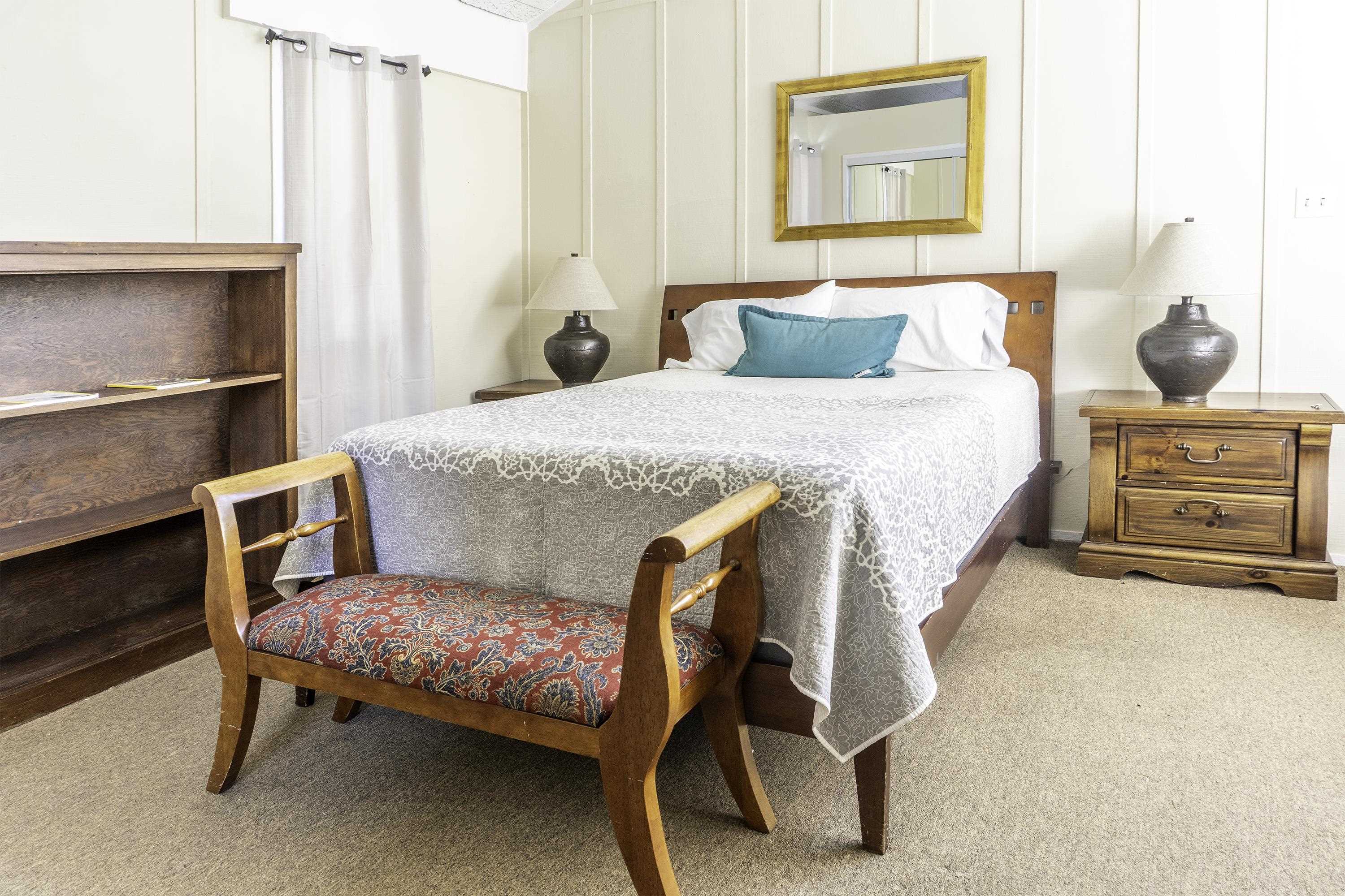 76 Alderman Street June Lake, CA 93529 - Photo 30 of 38 Bedroom with carpet floors and a decorative wall