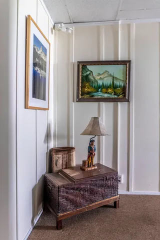a bed room with furniture and flat screen tv