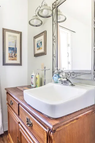 a bathroom with a sink and a mirror