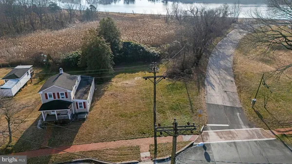 a aerial view of a house with a yard