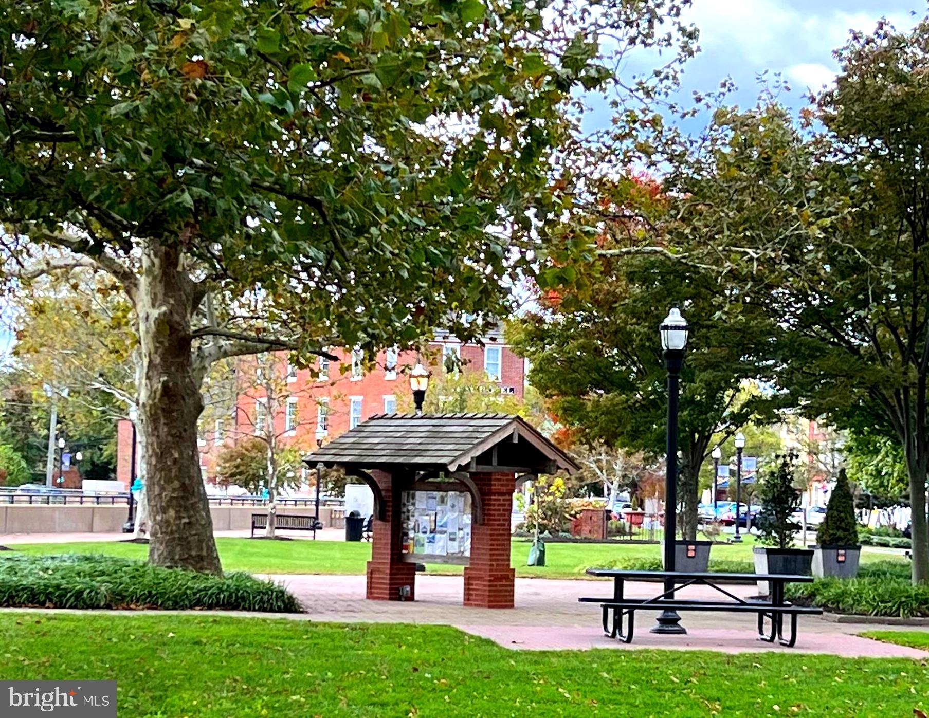 0 Delaware Street New Castle, DE 19720 - Photo 29 of 43 a view of a park with large trees and a wooden bench