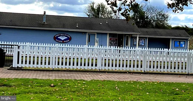 a view of swimming pool with outdoor seating and yard in back