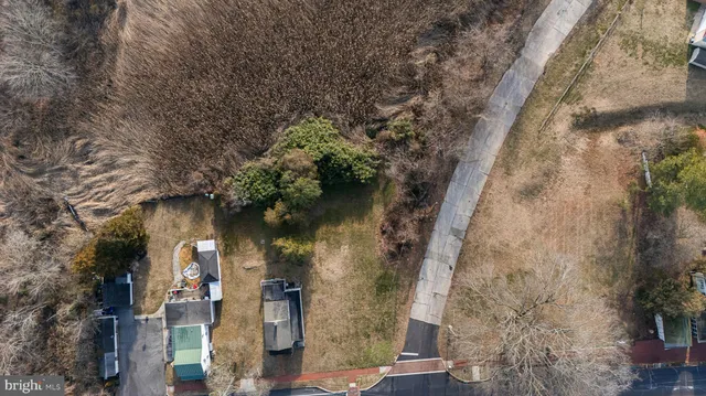 a aerial view of a house with a yard