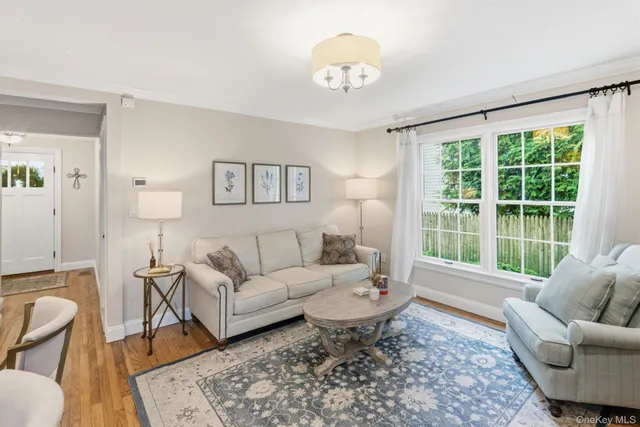 a bathroom with a granite countertop sink a mirror and shower