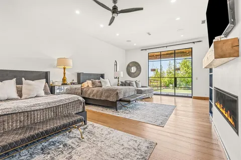 a living room with furniture and a dresser