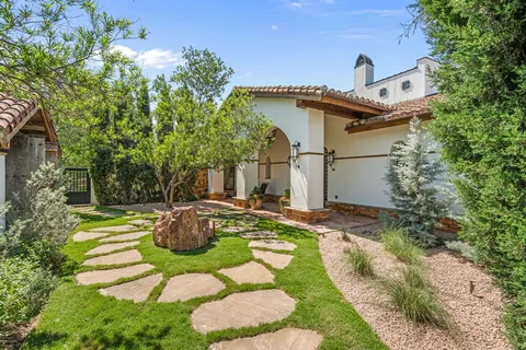 a front view of a house with garden